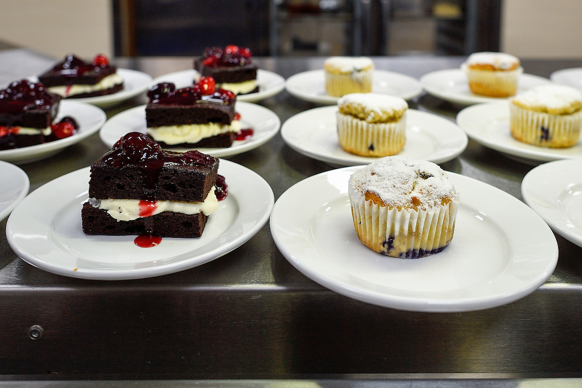 Cakes and Cupcakes on a cold food line in the Kitchen West Dining Hall