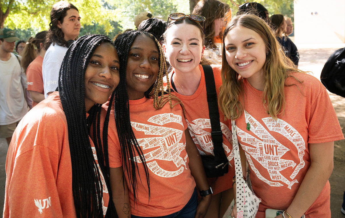 Student's posing together at the mean green fling event