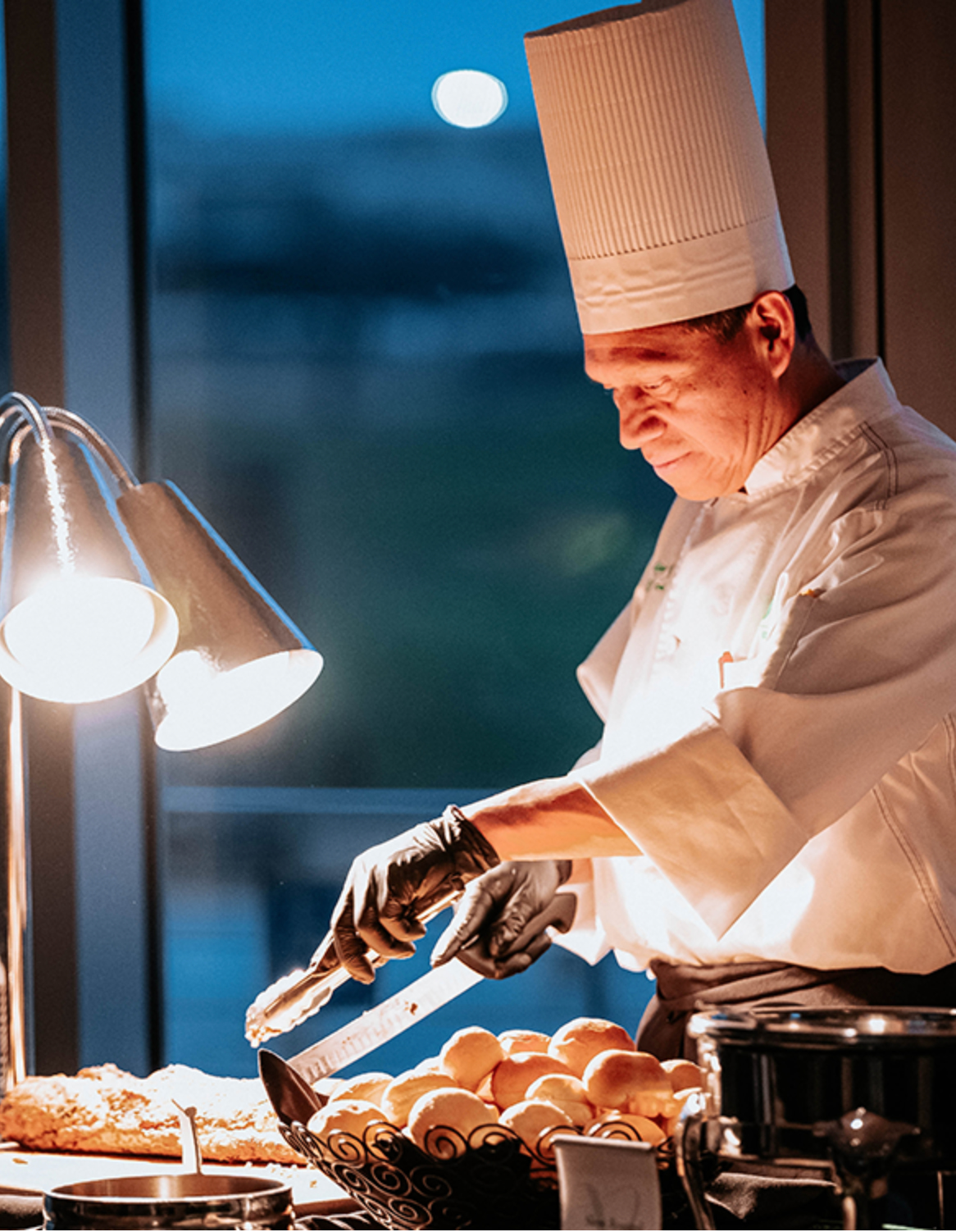 CHEF COOKING IN AMBIENT LIGHT 