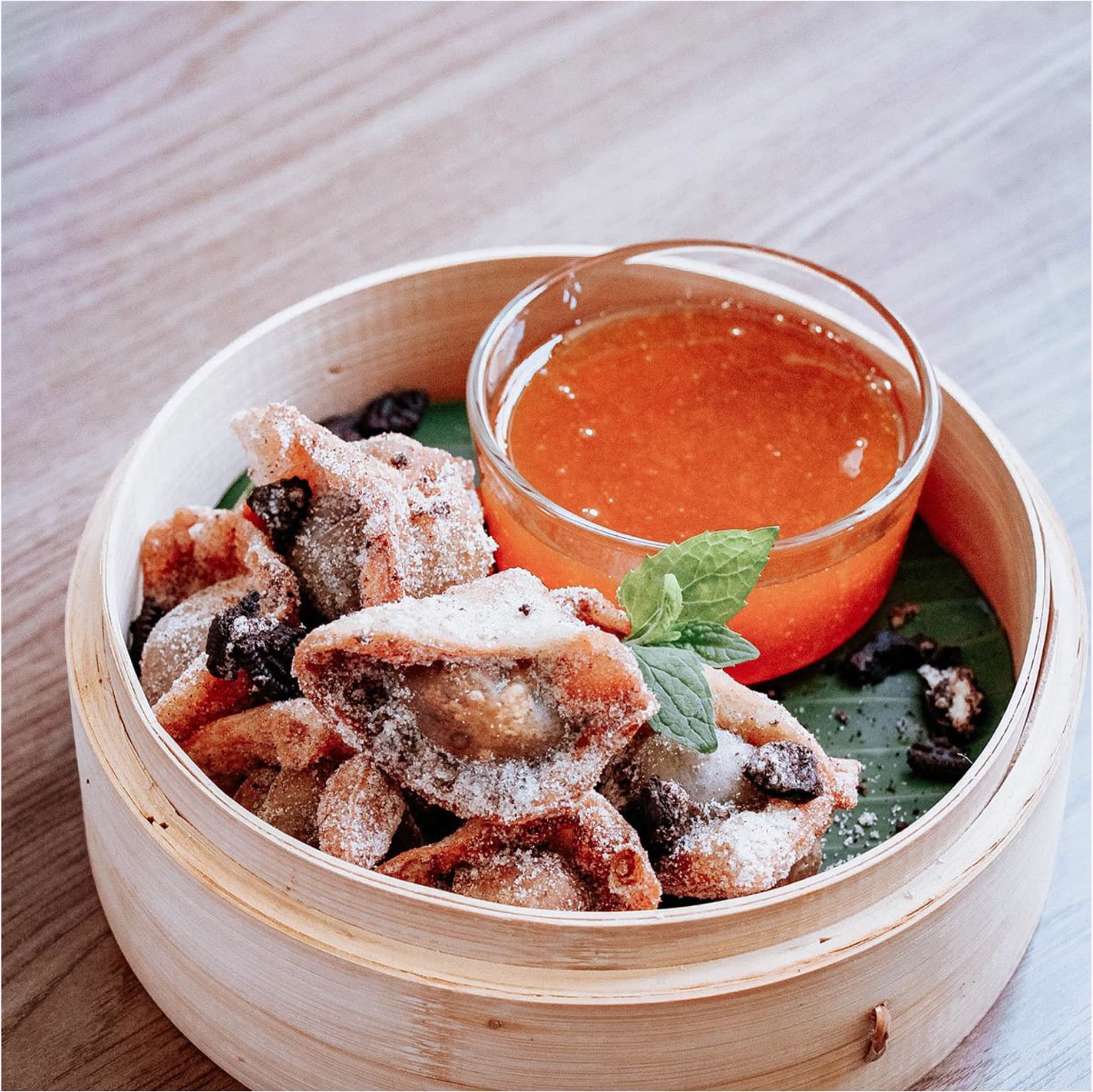 Fried wontons with dipping sauce from Mean Greens Café.
